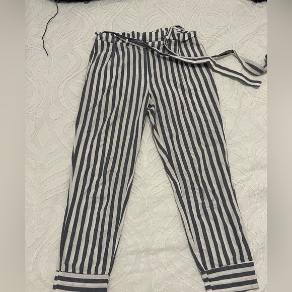 Blue and white striped linen pants with a paper bag waist and belt. - Picture 3 of 5